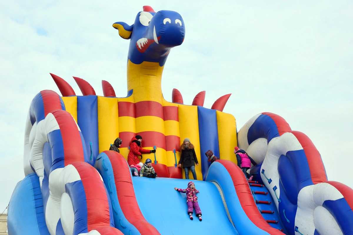 nflatable slide. Area for entertainment of children at a street festival.